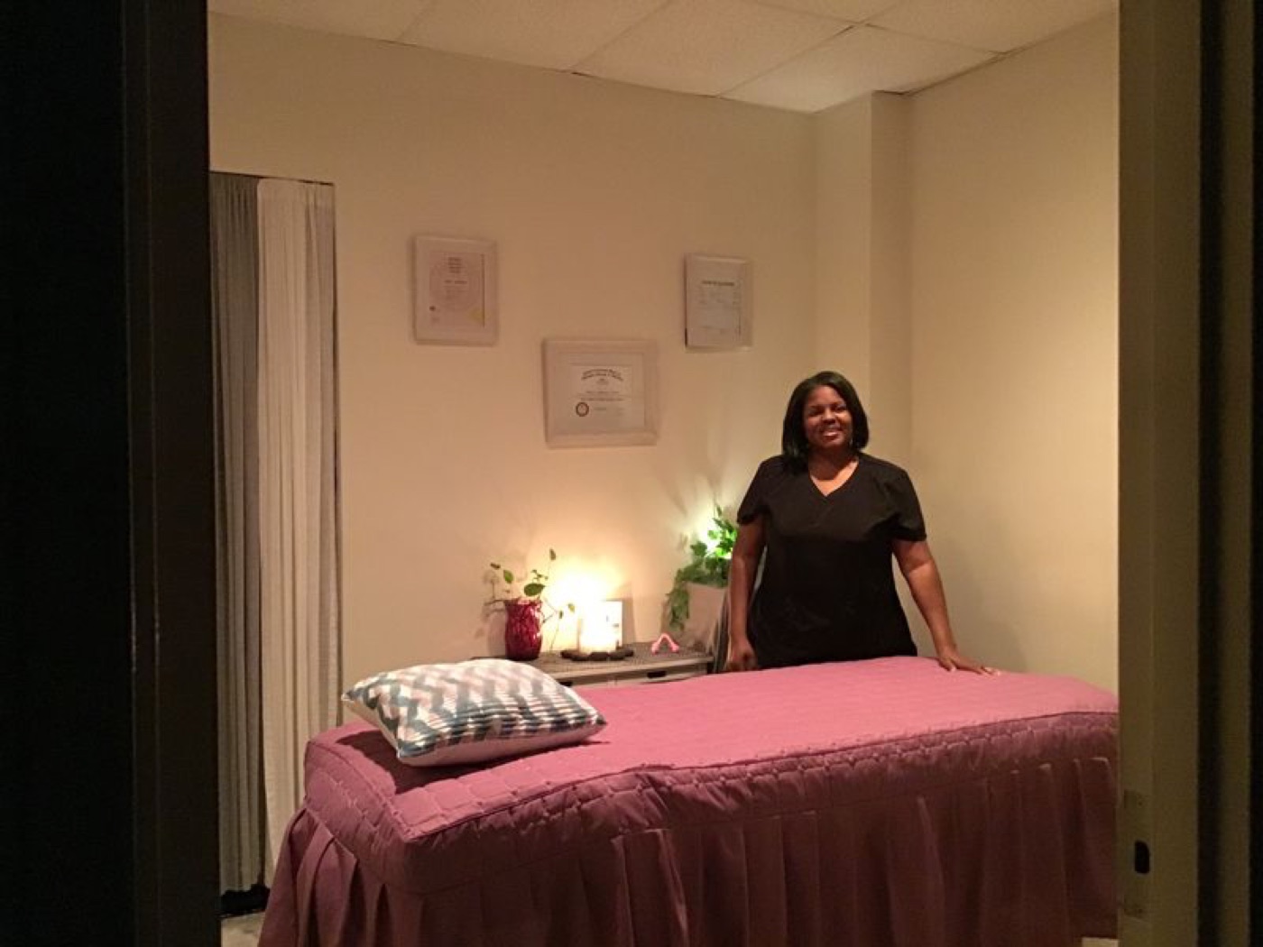 Etete Agbabune Torres in her candlelit Huntsville massage studio