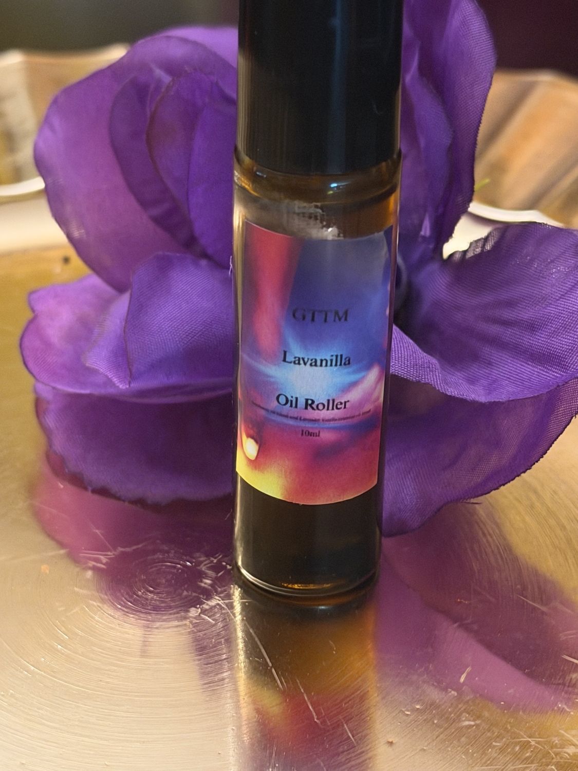 Lavanilla oil roller standing on a gold tray